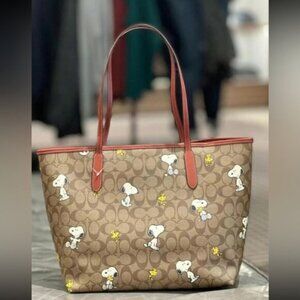 Coach X Peanuts City Tote In Signature Canvas With Snoopy Woodstock Print